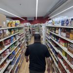 American shoppers buying groceries amid rising household expenses