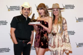 Taylor Swift recalls a cricket prank involving country singer Brad Paisley during her induction speech.
